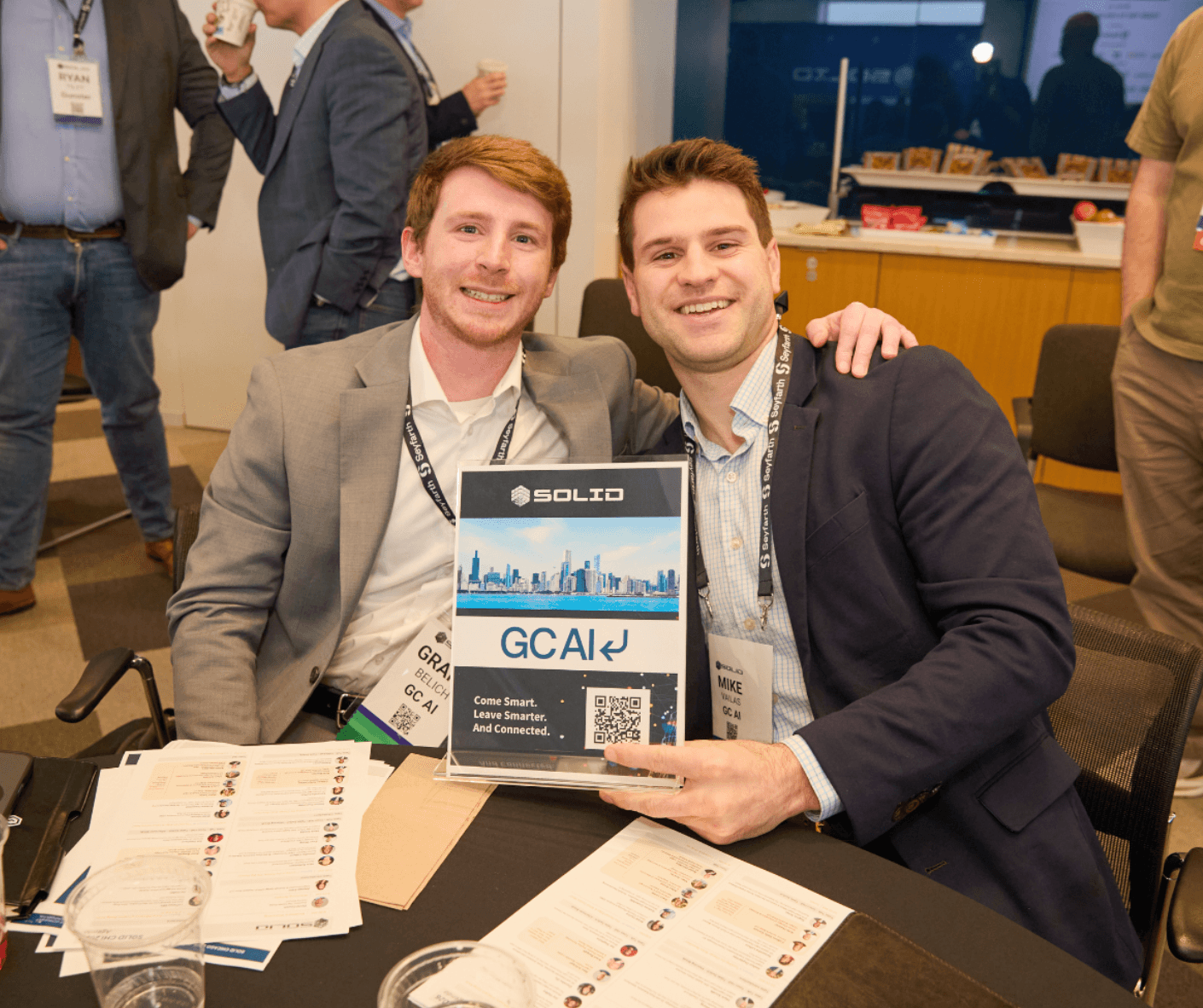 Two GC AI teammates at a conference booth